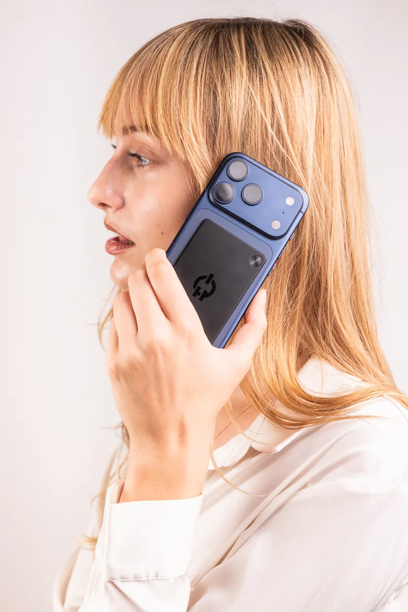 A woman on a phone call with Ruune on the back of her phone.